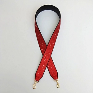 Red glitter bag strap with gold metal swivel hooks and black backing for cross body bags