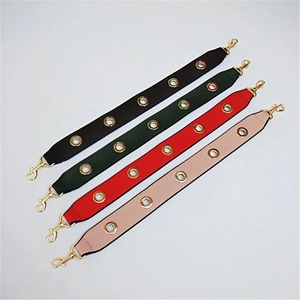 Detail view of wide PU leather replacement bag straps in black, green, red and pink