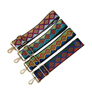 Detail of adjustable ethnic geometric woven bag straps with gold metal swivel hooks