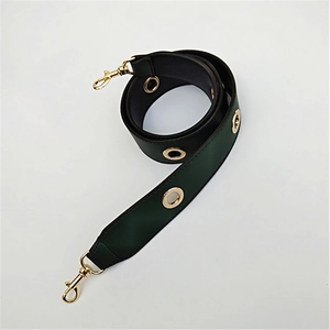 Detail of wide PU leather replacement strap with gold eyelets and lobster clasps