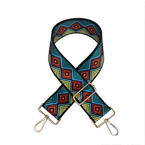 Adjustable wide replacement bag strap with ethnic geometric pattern and gold hardware