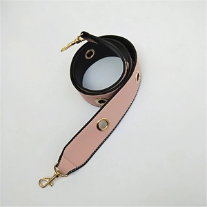 Detail view of pink and black PU leather replacement strap with gold eyelets and hooks