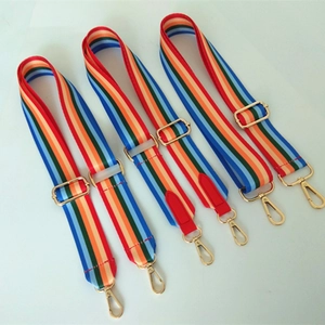 Adjustable colorful rainbow striped bag strap with golden metal hardware and red leather