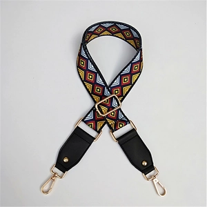 Adjustable wide woven guitar strap with colorful geometric patterns and gold metal hooks