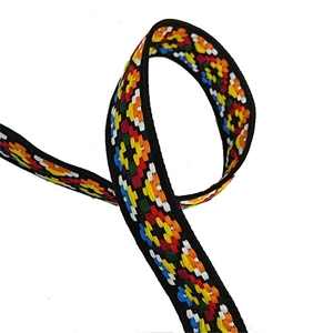 Detailed view of colorful ethnic embroidery patterns on an adjustable thick bag strap