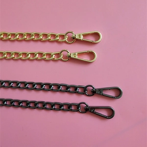 Detail view of metallic gold and gun black replacement bag chains with lobster clasps