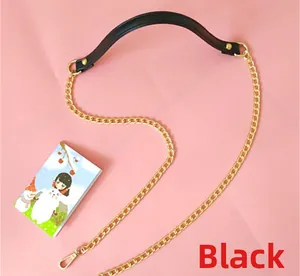 Close-up of black PU leather shoulder strap with gold metal O-chain and lobster clasp