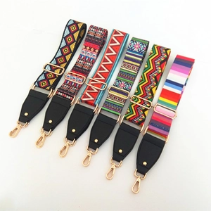 Detail of adjustable bohemian colorful wide shoulder straps with gold metal hooks and leather
