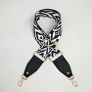 Adjustable wide replacement bag strap with black and white wave pattern and gold hooks