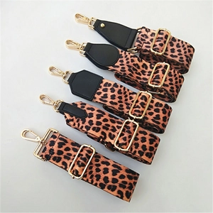 Detail view of five leopard print adjustable shoulder straps with gold metal clasps