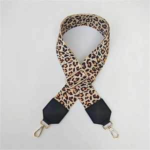 Adjustable leopard print wide shoulder strap with golden metal swivel hooks and leather ends