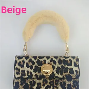 Leopard print handbag detail with plush yellow faux fur handle and gold twist lock