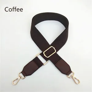 Detail view of coffee brown adjustable crossbody bag strap with gold metal hooks and PU leather