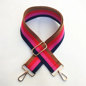 Close-up of adjustable colorful striped bag strap with golden metal lobster clasps