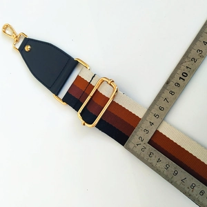 Adjustable 4cm wide striped nylon bag strap with gold metal hooks and leather ends