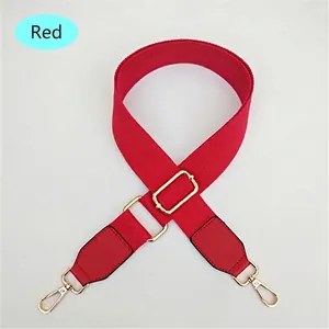 Adjustable red nylon shoulder strap with gold metal buckles for cross-body handbags