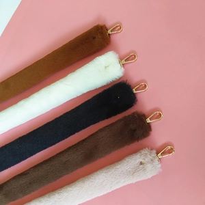 Faux fur animal tail bag charms in five colors with gold lobster clasps and fluffy texture