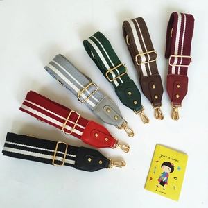 Adjustable woven canvas shoulder straps with gold hooks and leather ends for crossbody bags