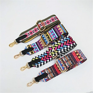Detail of four colorful ethnic weave wide bag straps with gold metal hooks and adjusters