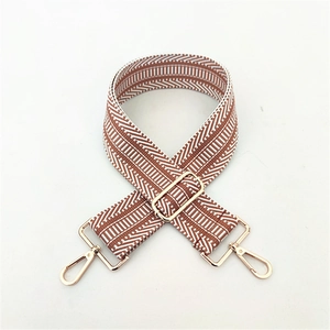 Adjustable wide replacement shoulder strap with brown geometric patterns and gold buckles