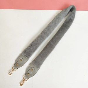 Plush grey faux rabbit fur shoulder strap with leather ends and golden metal clasps