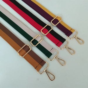 Adjustable nylon shoulder strap with contrast stripes and gold hardware in four colors