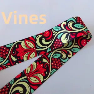 Detail view of ethnic vine pattern on durable nylon bag strap with red and green weave