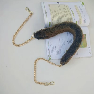Dark brown plush shoulder strap with golden metal chains and swivel lobster clasps