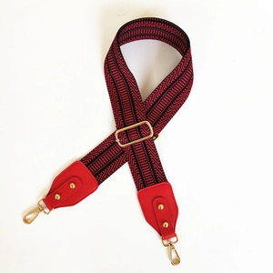 Adjustable wide replacement bag strap with red and black ethnic embroidery and gold hooks