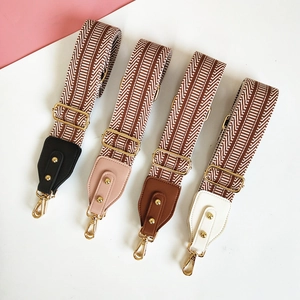 Adjustable wide embroidered bag straps with ethnic geometric stripes and gold hardware