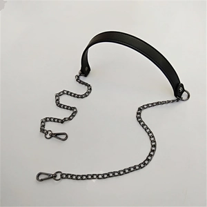 Detail view of black PU leather shoulder strap with gunmetal chains and lobster clasps