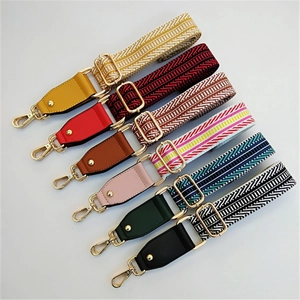 Selection of wide woven replacement straps with colorful patterns and gold-tone metal buckles