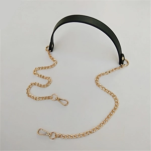 Detail of black PU leather shoulder strap with light gold metal chain and swivel hooks