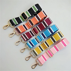 Close-up of colorful striped nylon replacement straps with golden metal buckles