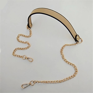 Detail of beige PU leather shoulder strap with gold chain links and swivel lobster clasps