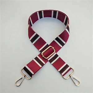 Adjustable wide replacement bag strap with burgundy, black and white stripes and gold buckles