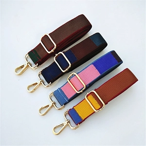 Close-up of adjustable colorful wide nylon shoulder straps with gold metal buckles