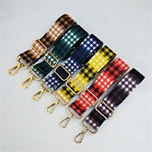 Detailed flat lay of adjustable ethnic canvas straps in colorful checkered patterns