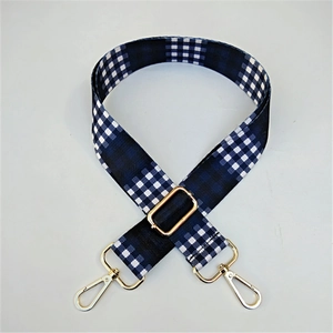 Adjustable woven canvas shoulder strap with blue gingham pattern and gold hardware