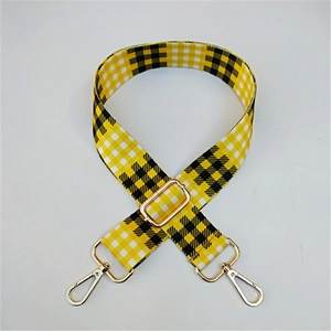 Adjustable yellow and black checkered canvas strap with gold metal lobster clasps for bags