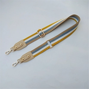 Adjustable woven purse strap with colorful stripes and gold metal buckles for handbags