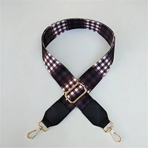 Detail of adjustable wide shoulder strap with purple and black checkerboard pattern
