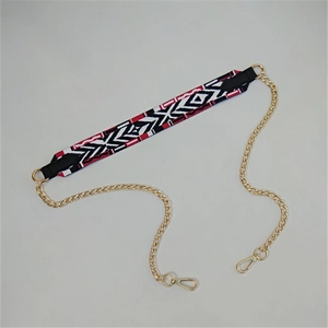 Detail of geometric woven strap with gold chains and lobster clasps for handbags
