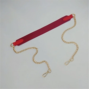 Detail of red fabric bag strap with golden metal chains and durable lobster clasps