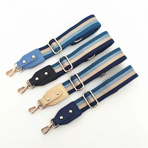Adjustable woven shoulder straps with leather ends and gold metal buckles for handbags