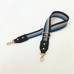 Adjustable striped shoulder strap for handbags with navy blue and gold metal buckles