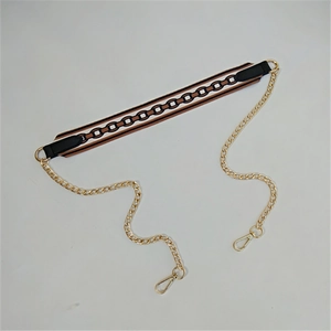 Detail of woven fabric strap with gold metal chain and rotating lobster clasps for handbags