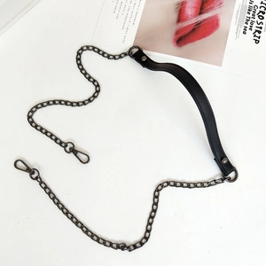 Detail view of gunmetal chain strap with black PU leather handle and lobster clasps