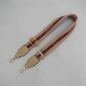 Adjustable wide woven bag strap with brown stripe patterns and golden metal snap hooks
