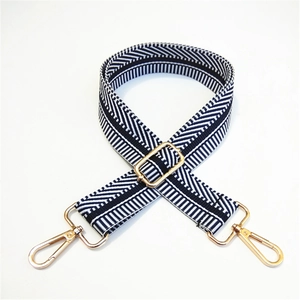 Detailed view of striped adjustable strap with durable gold lobster clasps and metal buckle
